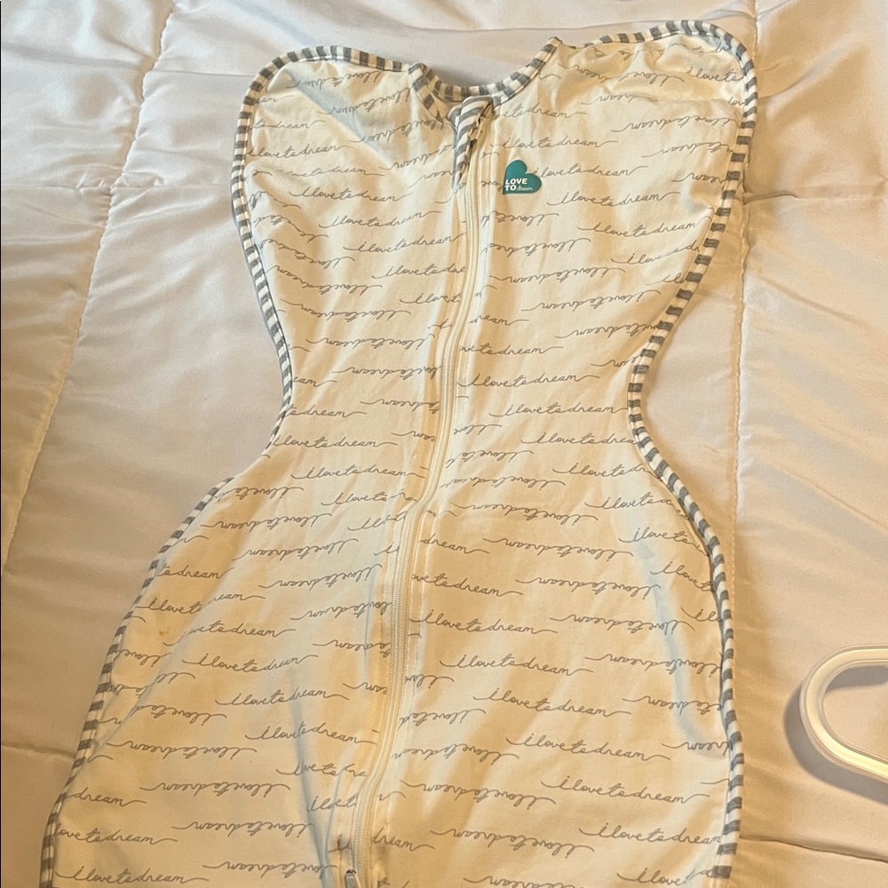 Love to dream Cream Swaddle with Gray Script and Striped Trim